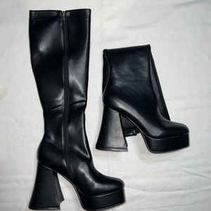 Black knee-high statement platform heeled boots